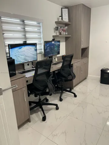 a bedroom with furniture and a window