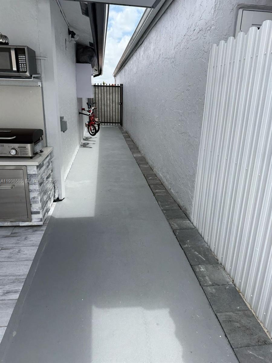 2837 West 75th Street Hialeah, FL 33018 - Photo 22 of 22 a hallway with a couch