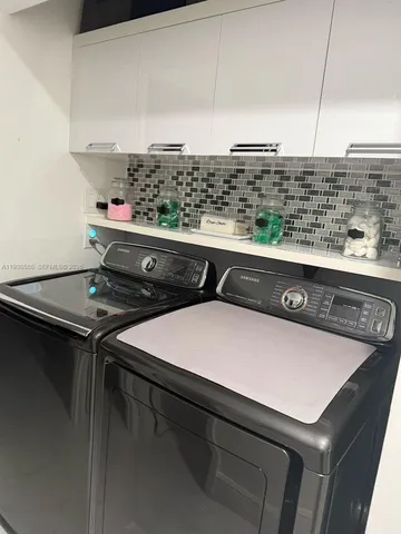 a bathroom with a toilet sink and shower