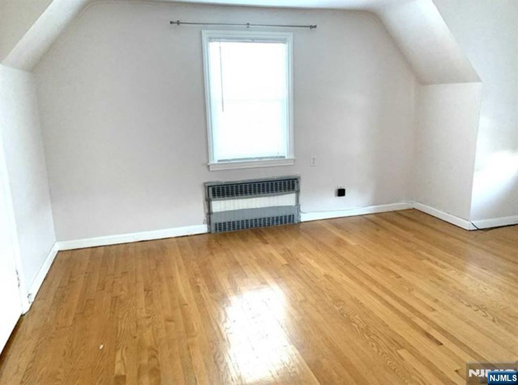 321 Roff Avenue Palisades Park, NJ 07650 - Photo 6 of 12 wooden floor and window in an empty room