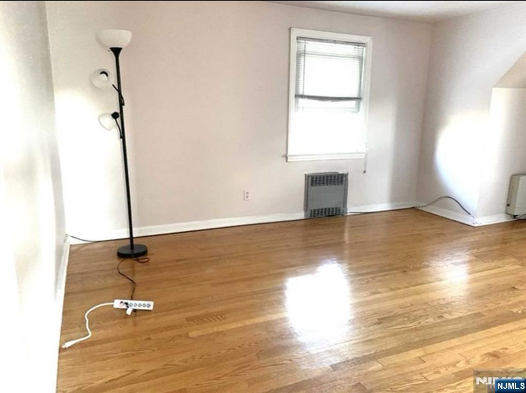 321 Roff Avenue Palisades Park, NJ 07650 - Photo 8 of 12 a view of empty room with wooden floor