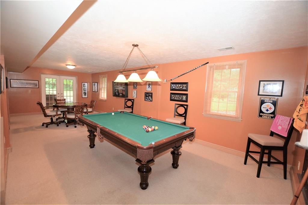 10319 Ridgecrest Point Wexford, PA 15090 - Photo 20 of 24 Finished Game Room, game side walks out to small, private patio