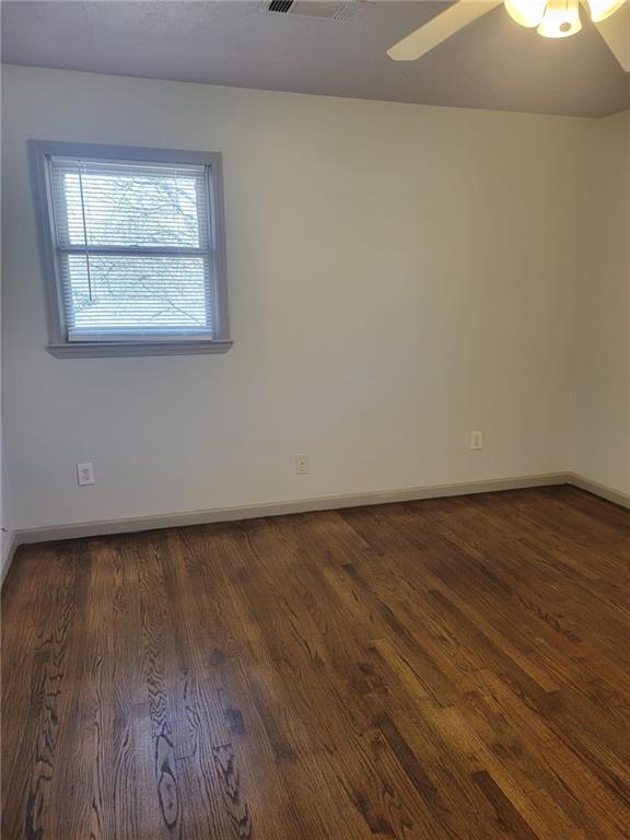 1063 Pleasant Hill Road, Unit A Lawrenceville, GA 30044 - Photo 13 of 18 a view of a room with wooden floor and window