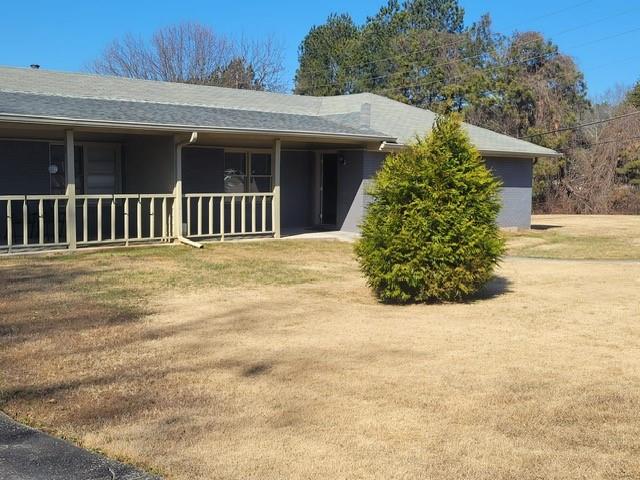 1063 Pleasant Hill Road, Unit A Lawrenceville, GA 30044 - Photo 2 of 18 a front view of a house having yard