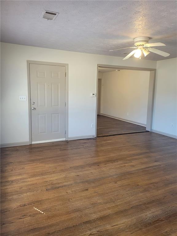 1063 Pleasant Hill Road, Unit A Lawrenceville, GA 30044 - Photo 5 of 18 a view of an empty room with wooden floor