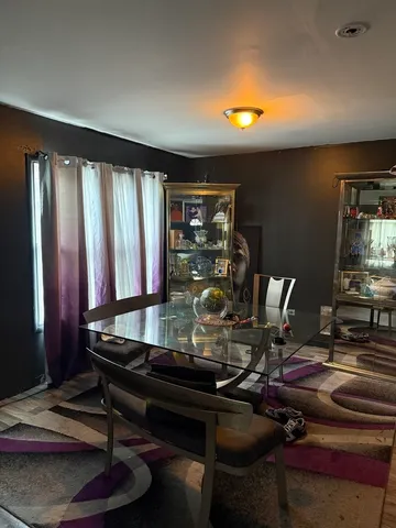 a room with furniture and musical instruments