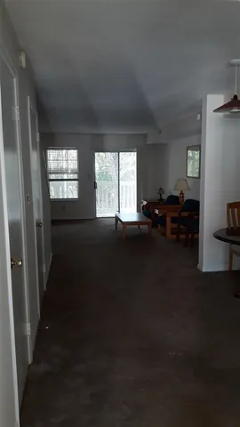 a living room with furniture window and wooden floor