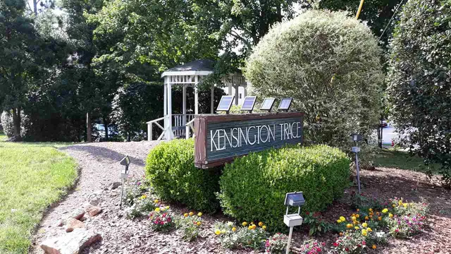 a view of a street with sign board