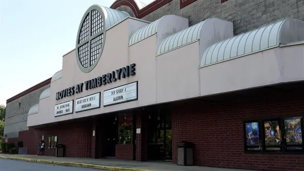 a front view of a building with sign board