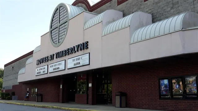 a front view of a building with sign board