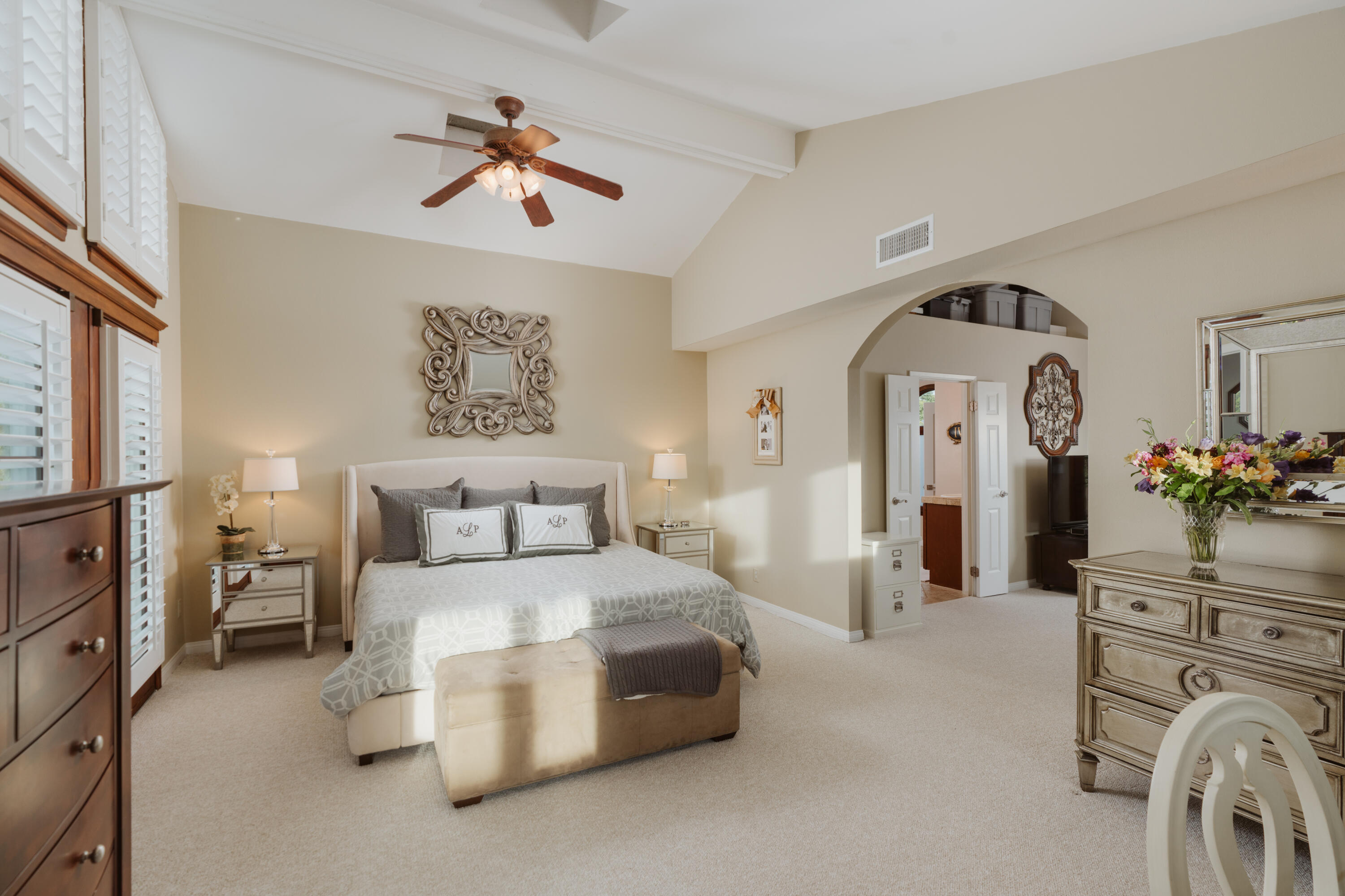 844 Meigs Road Santa Barbara, CA 93109 - Photo 11 of 32 a spacious bedroom with a bed and a chandelier