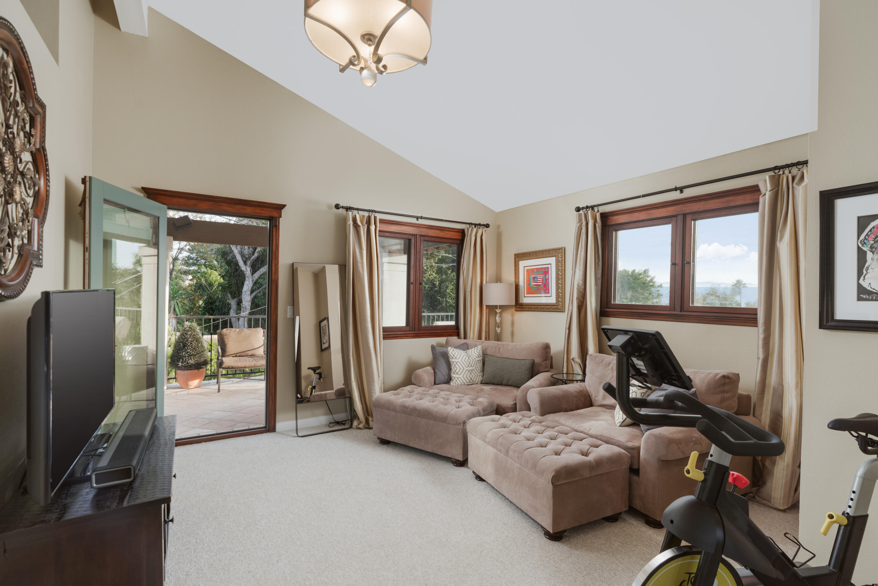 844 Meigs Road Santa Barbara, CA 93109 - Photo 13 of 32 a living room with furniture and a flat screen tv