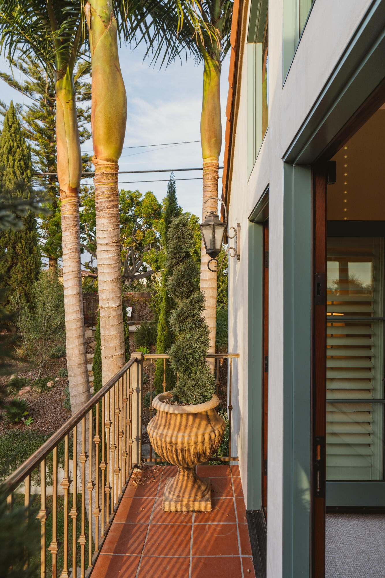 844 Meigs Road Santa Barbara, CA 93109 - Photo 17 of 32 a view of a balcony with wooden floor and a palm tree