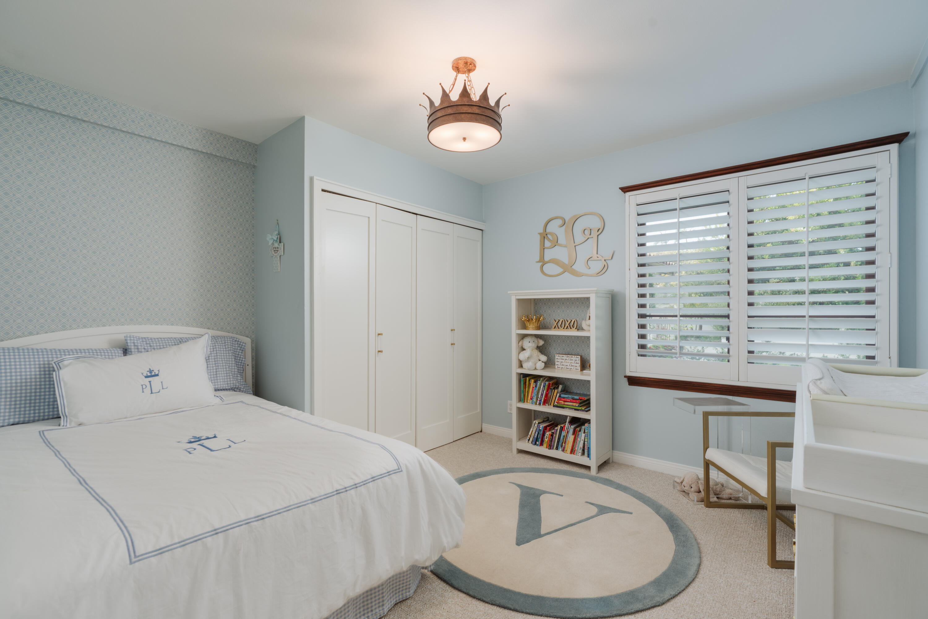 844 Meigs Road Santa Barbara, CA 93109 - Photo 21 of 32 a bedroom with a bed a dresser and a large mirror