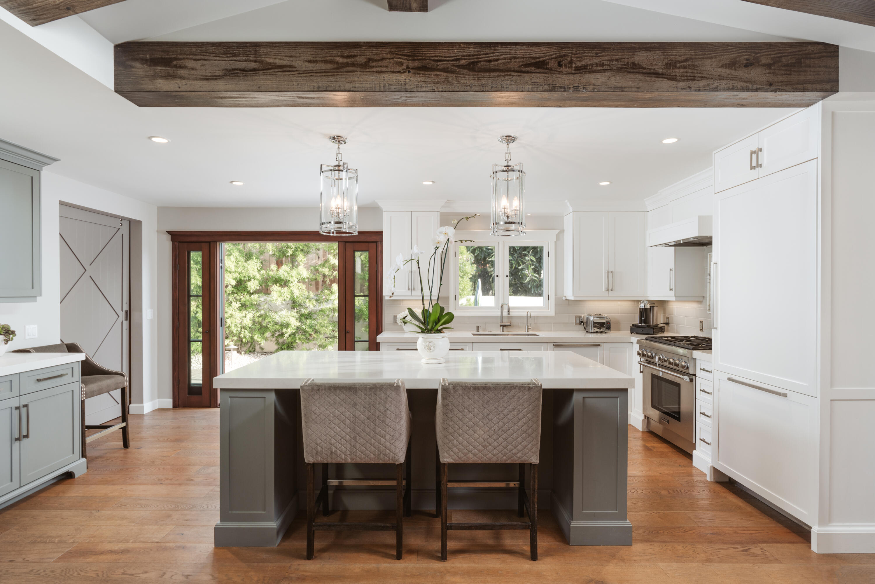 844 Meigs Road Santa Barbara, CA 93109 - Photo 5 of 32 a kitchen with stainless steel appliances granite countertop a table chairs stove and refrigerator