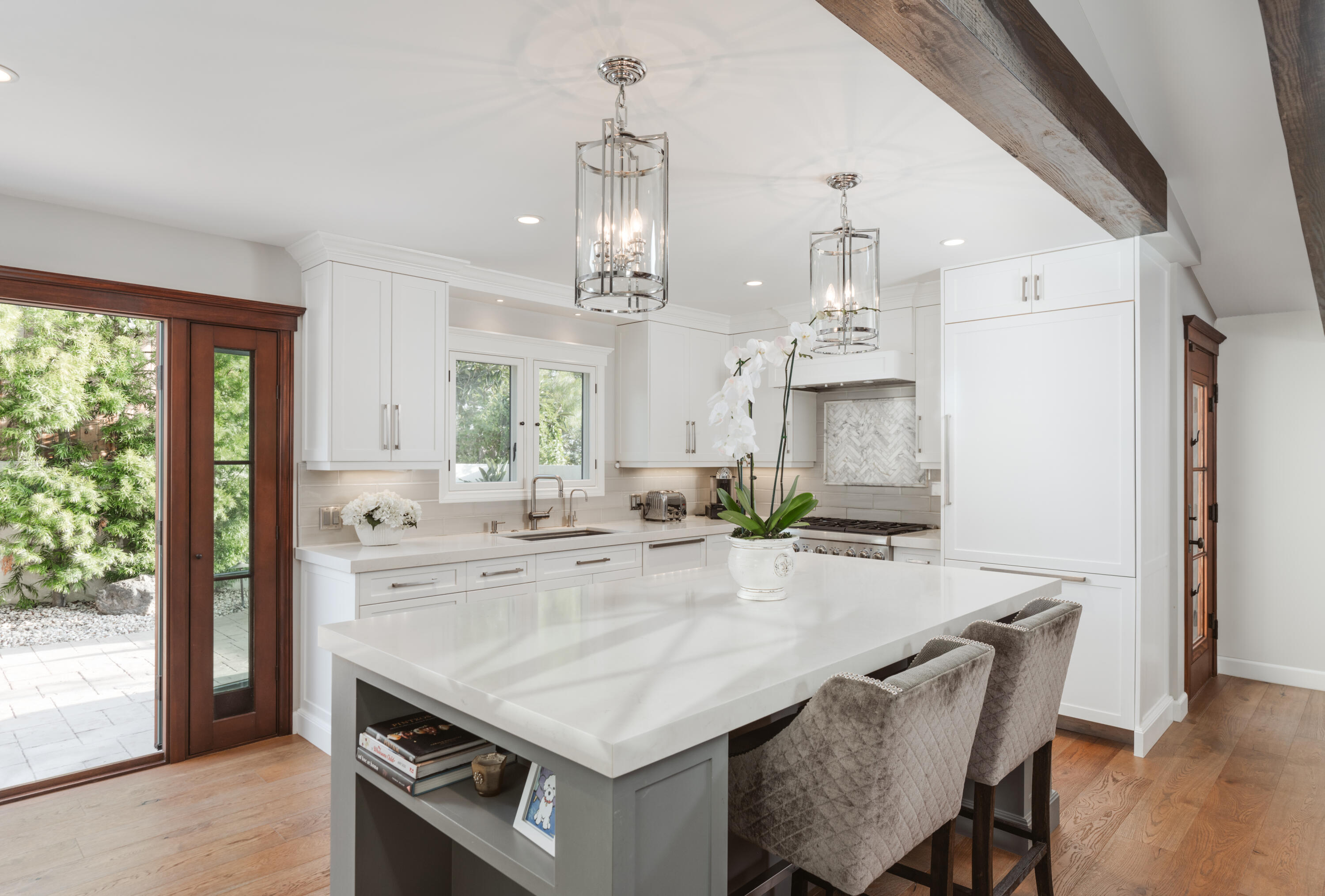 844 Meigs Road Santa Barbara, CA 93109 - Photo 6 of 32 a kitchen with kitchen island a stove a refrigerator a sink dishwasher with a dining table and chairs