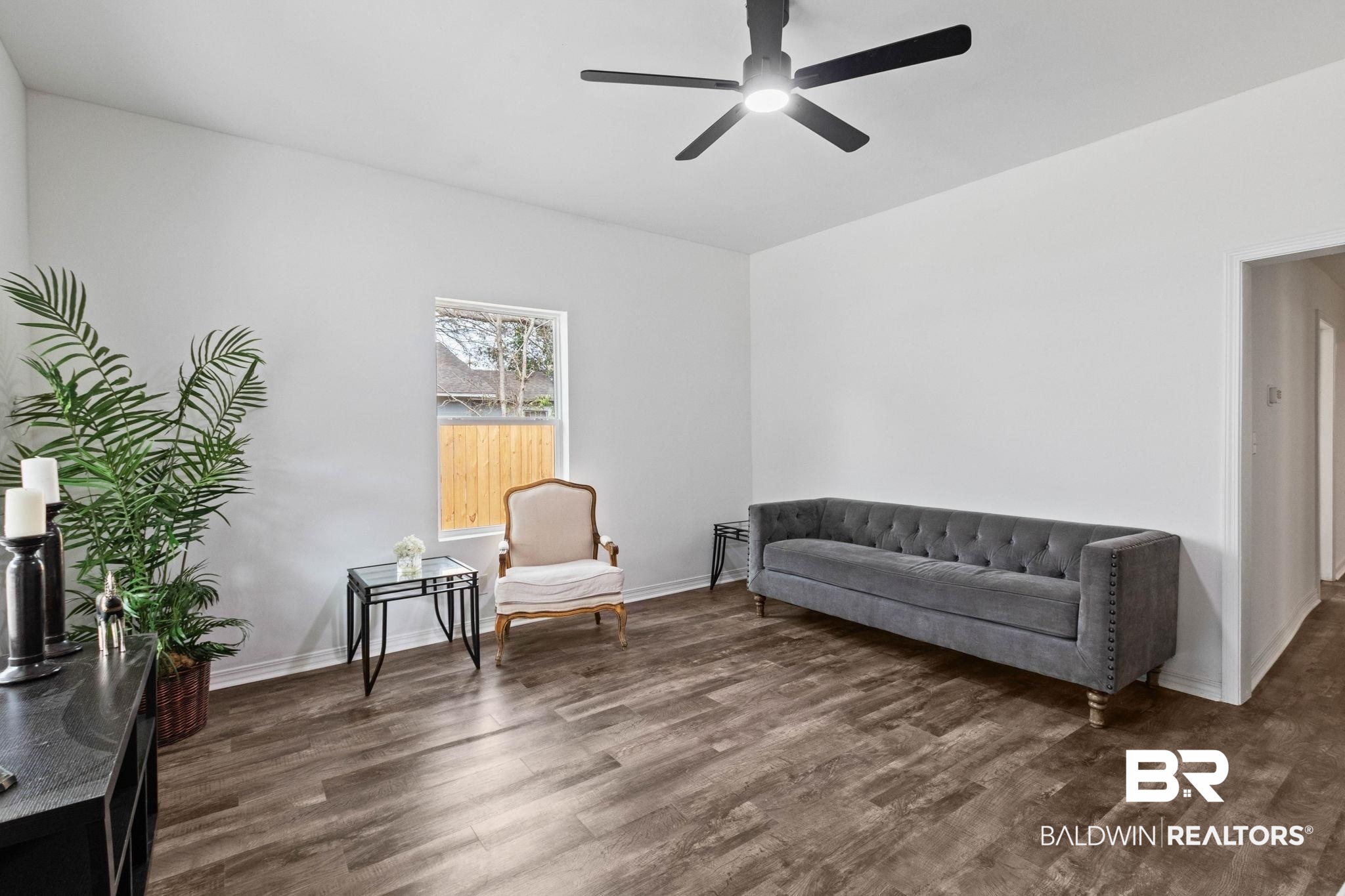 128 Bush Avenue Mobile, AL 36604 - Photo 4 of 40 Living area with dark wood-style floors and ceiling fan