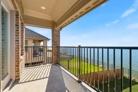 a view of balcony with wooden floor