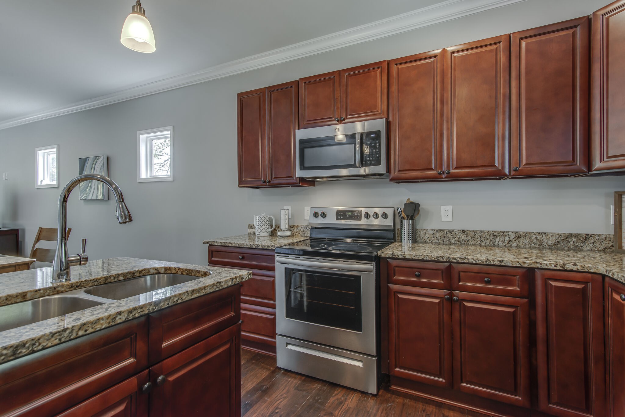 357 Flora Maxwell Road Nashville, TN 37211 - Photo 13 of 31 a kitchen with stainless steel appliances granite countertop a sink stove and microwave
