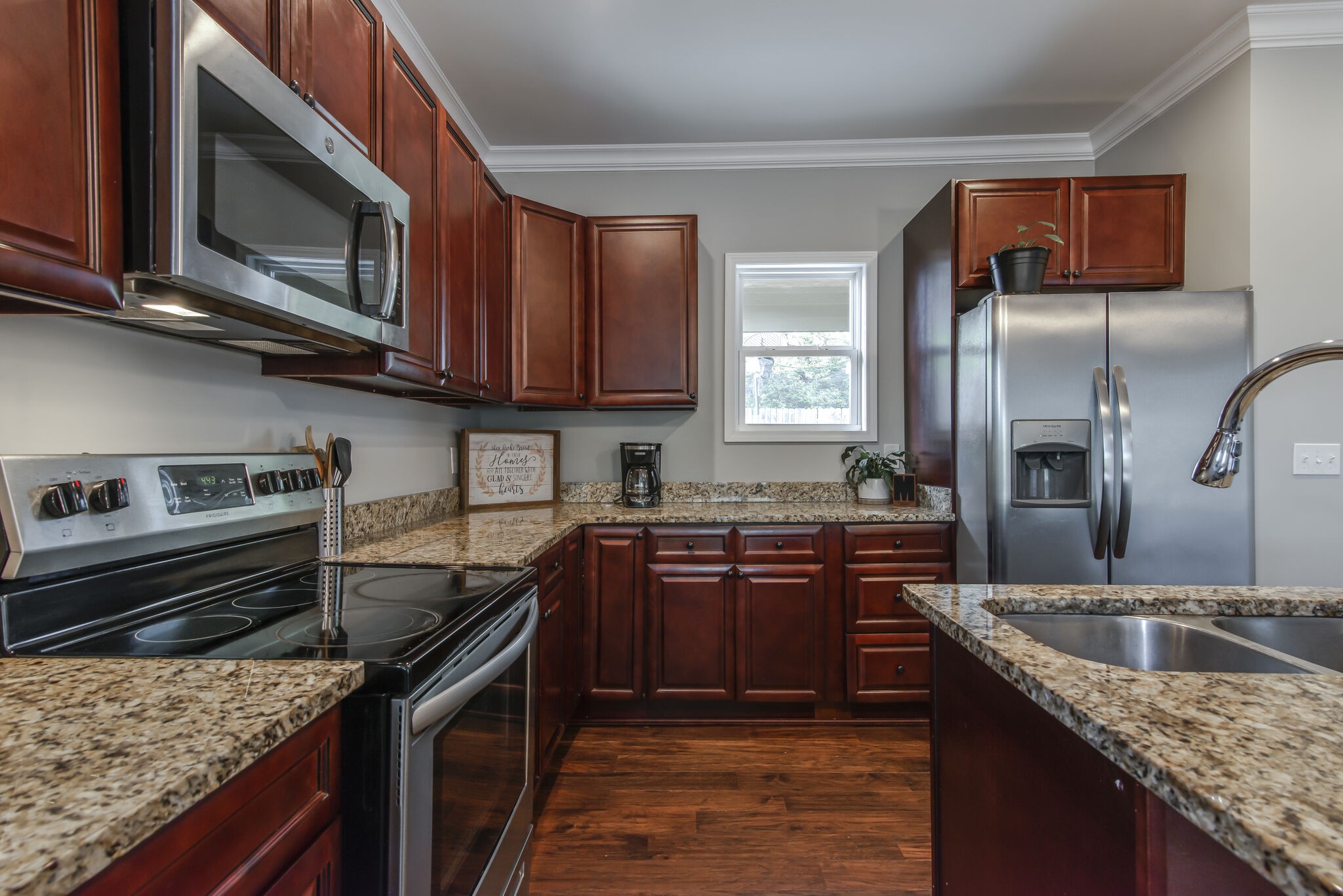 357 Flora Maxwell Road Nashville, TN 37211 - Photo 14 of 31 a kitchen with stainless steel appliances granite countertop a sink stove microwave and refrigerator