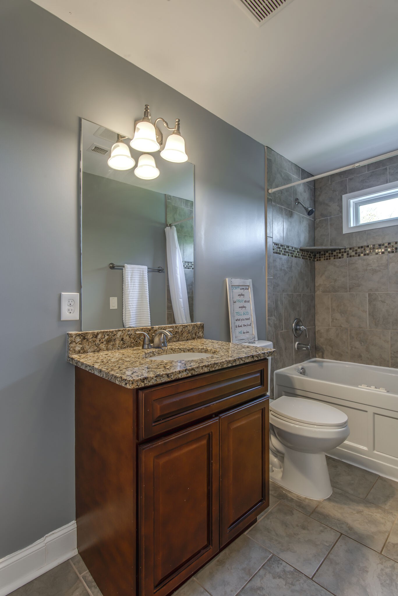 357 Flora Maxwell Road Nashville, TN 37211 - Photo 22 of 31 a bathroom with a granite countertop toilet a sink and a large mirror