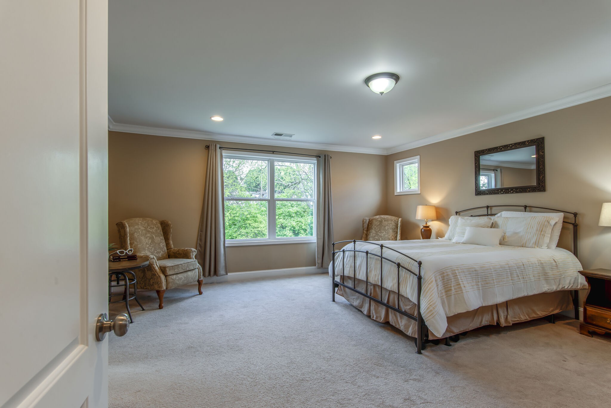 357 Flora Maxwell Road Nashville, TN 37211 - Photo 23 of 31 a spacious bedroom with a bed and a chair