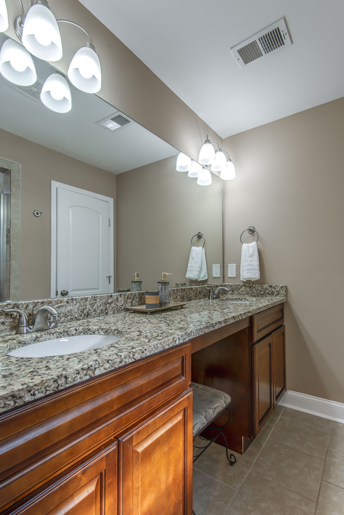 357 Flora Maxwell Road Nashville, TN 37211 - Photo 27 of 31 a bathroom with a granite countertop sink and a mirror