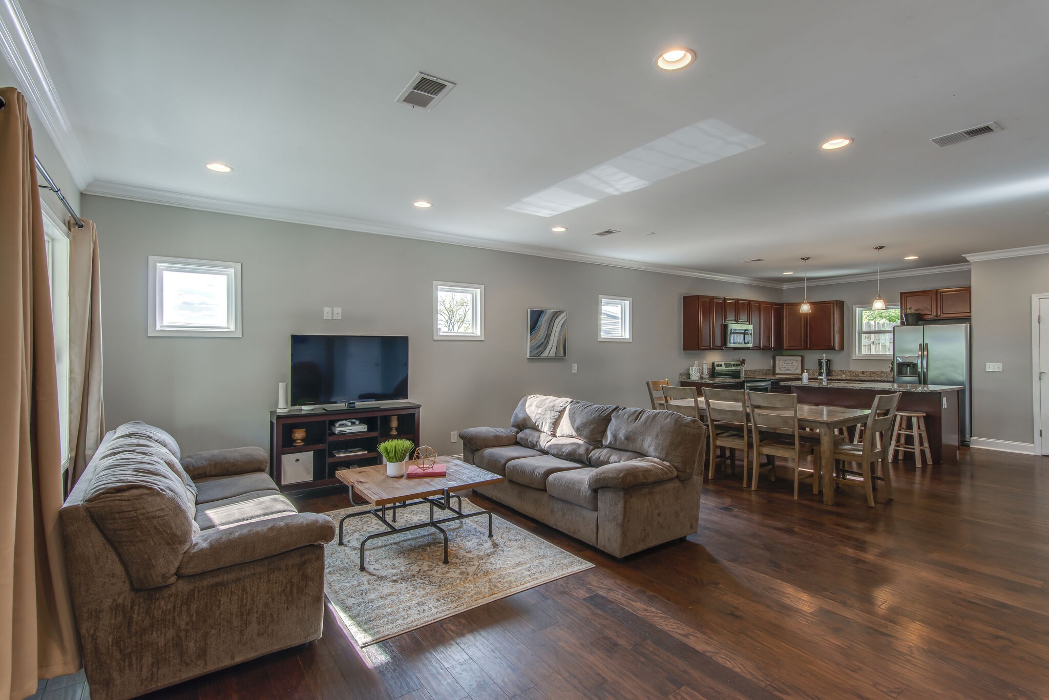 357 Flora Maxwell Road Nashville, TN 37211 - Photo 5 of 31 a living room with furniture kitchen view and a flat screen tv