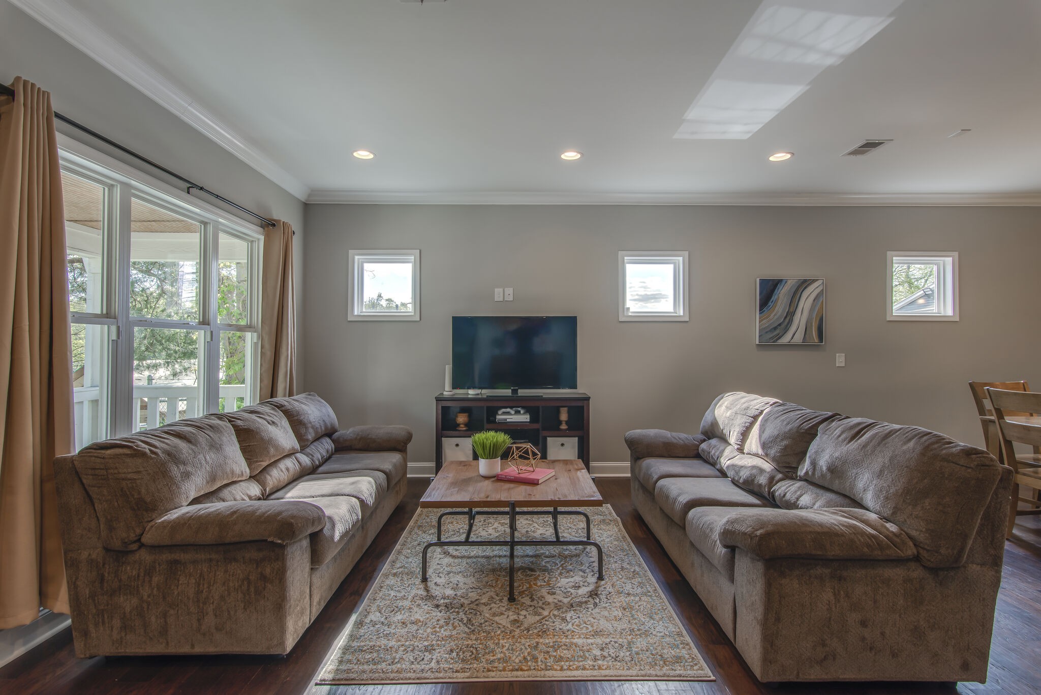 357 Flora Maxwell Road Nashville, TN 37211 - Photo 6 of 31 a living room with furniture and a flat screen tv