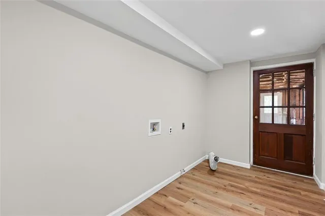 a view of a porch with furniture and front door