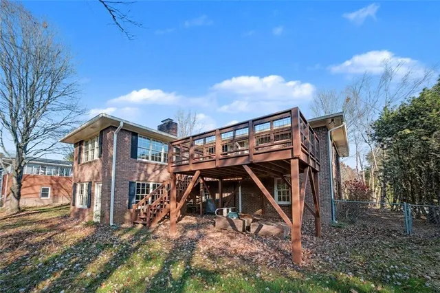 a backyard of a house with lots of green space and fountain