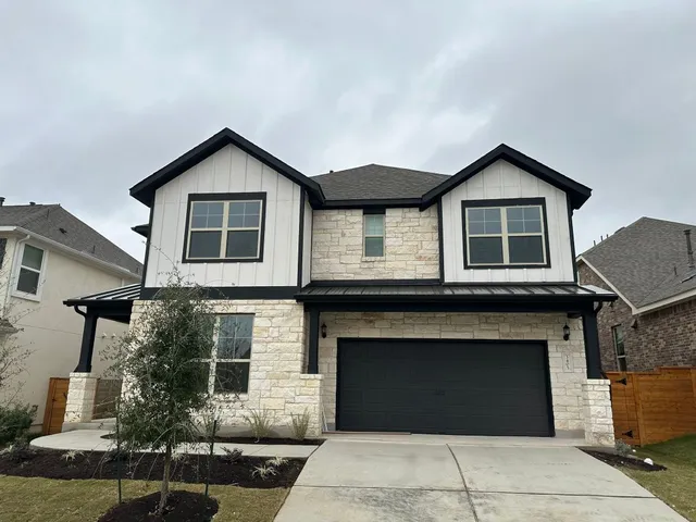 a front view of a house with garage