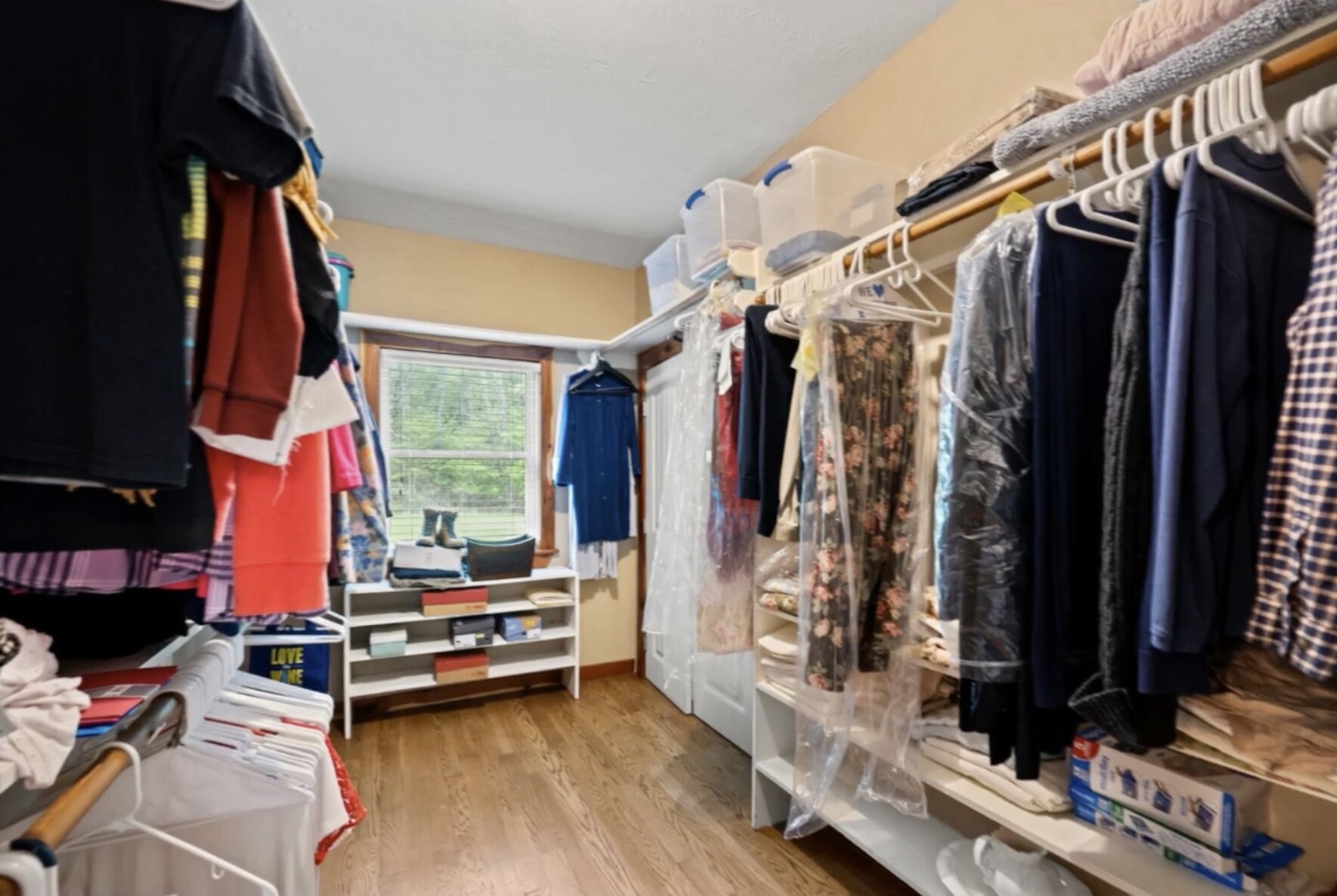 30338 Riley Road Waller, TX 77484 - Photo 22 of 46 a view of walk in closet with clothes and shoes
