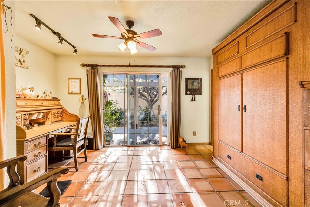 10341 Pinon Avenue Morongo Valley, CA 92256 - Photo 16 of 68 a view of a hallway with wooden floor and chandelier