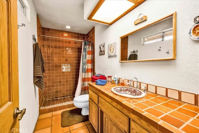 a reading room with furniture and a window