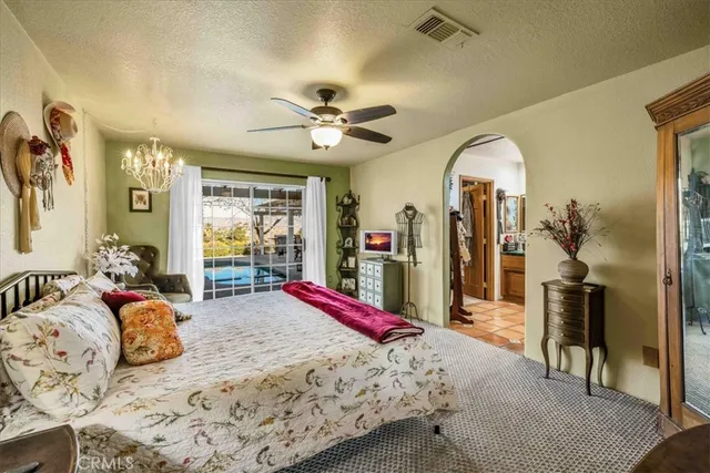 a view of a patio with table and chairs and potted plants