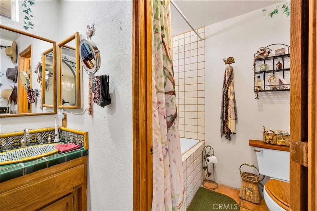 10341 Pinon Avenue Morongo Valley, CA 92256 - Photo 24 of 68 a bathroom with a sink and a mirror