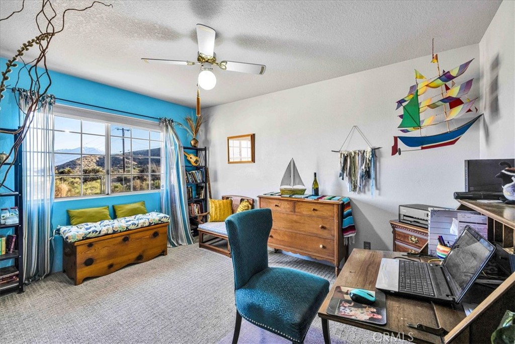 10341 Pinon Avenue Morongo Valley, CA 92256 - Photo 28 of 68 a reading room with furniture and a window