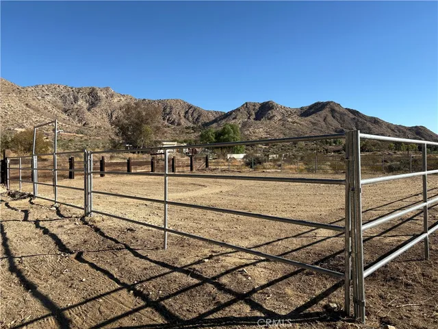 a view of a mountain with a mountain in the background