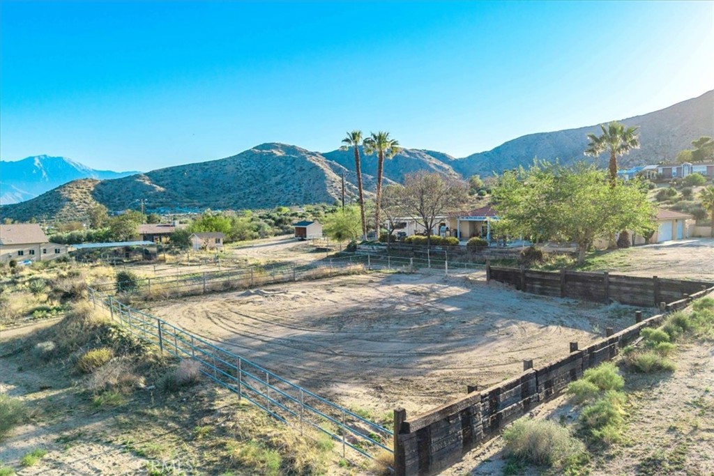 10341 Pinon Avenue Morongo Valley, CA 92256 - Photo 56 of 68 a view of a town with mountains in the background