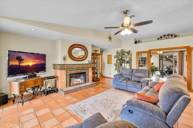 a living room with granite countertop furniture and a chandelier