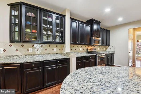 a view of a kitchen cabinets and wooden floor