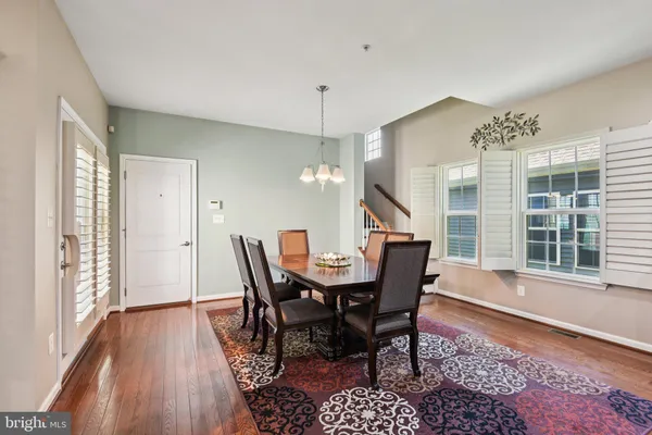 a living room with fireplace furniture and a wooden floor