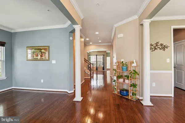 a view of an entryway with wooden floor