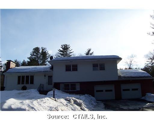 Exterior Front. Set off the road and surrounded by trees for privacy.