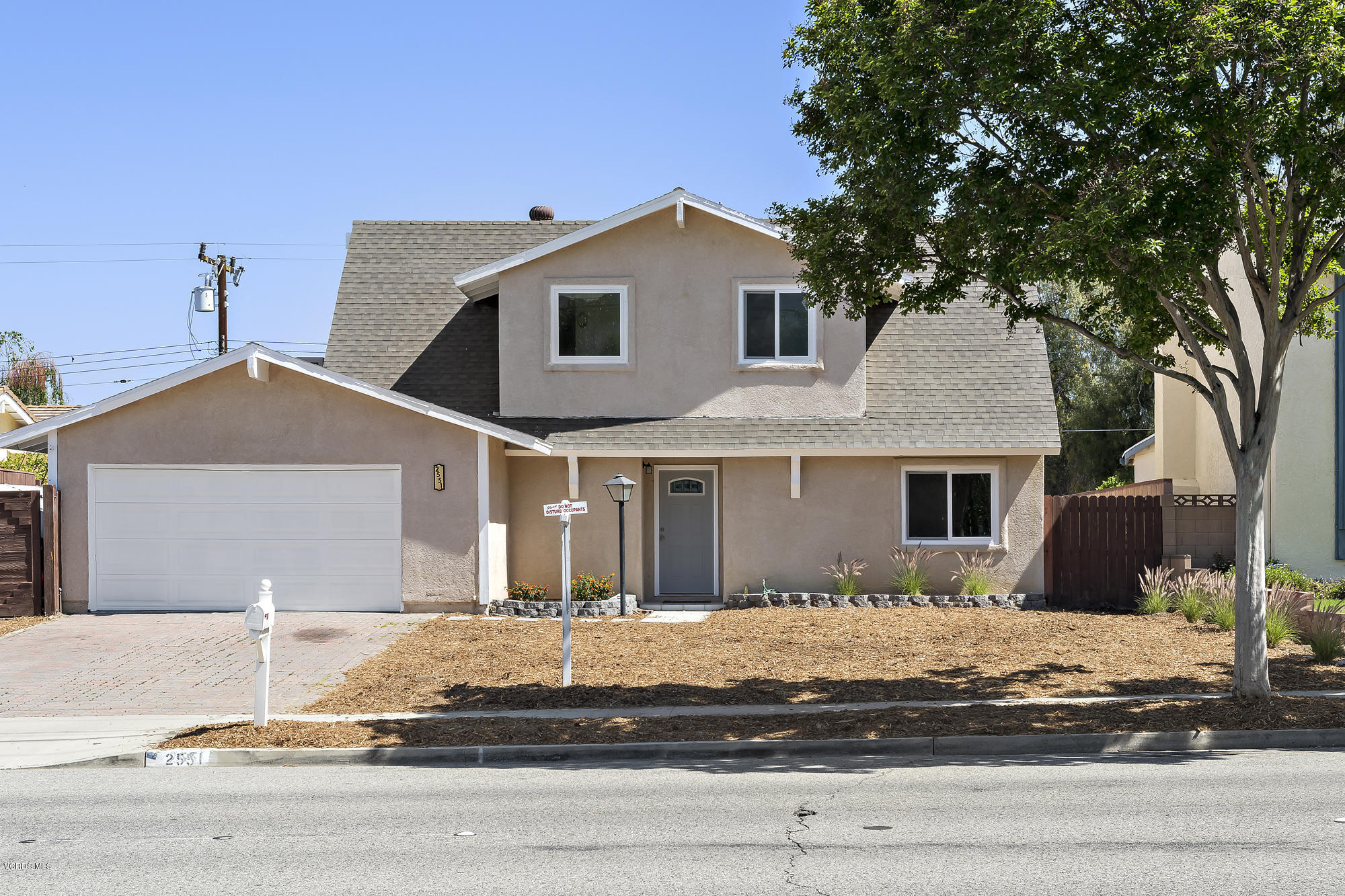 2551 Fitzgerald Road Simi Valley, CA 93065 - Photo 2 of 17 a front view of a house with a yard and garage