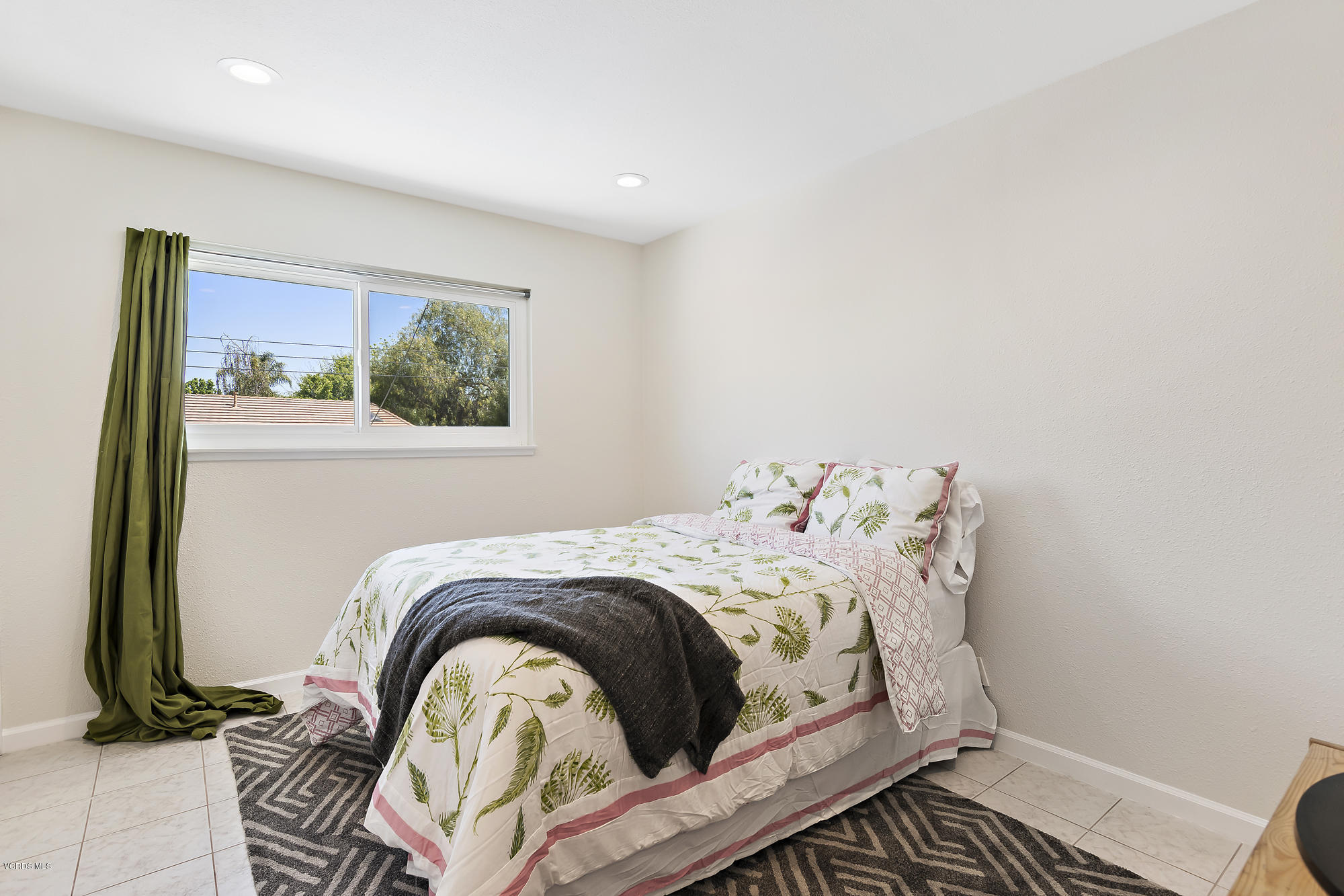 2551 Fitzgerald Road Simi Valley, CA 93065 - Photo 12 of 17 a bed sitting in a bedroom next to a window