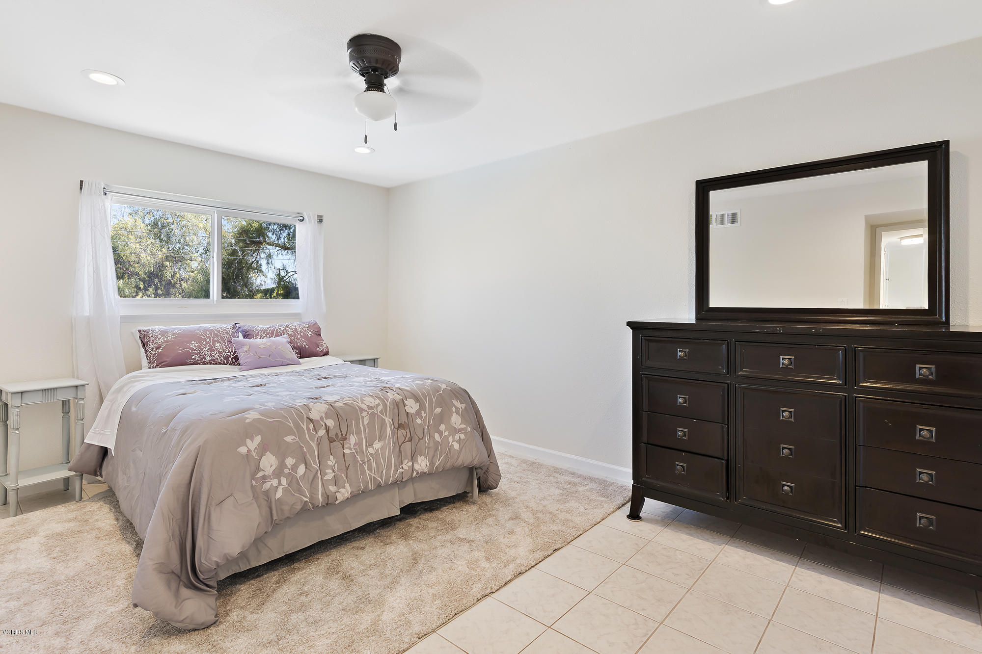 2551 Fitzgerald Road Simi Valley, CA 93065 - Photo 14 of 17 a bedroom with a bed and a mirror on dresser