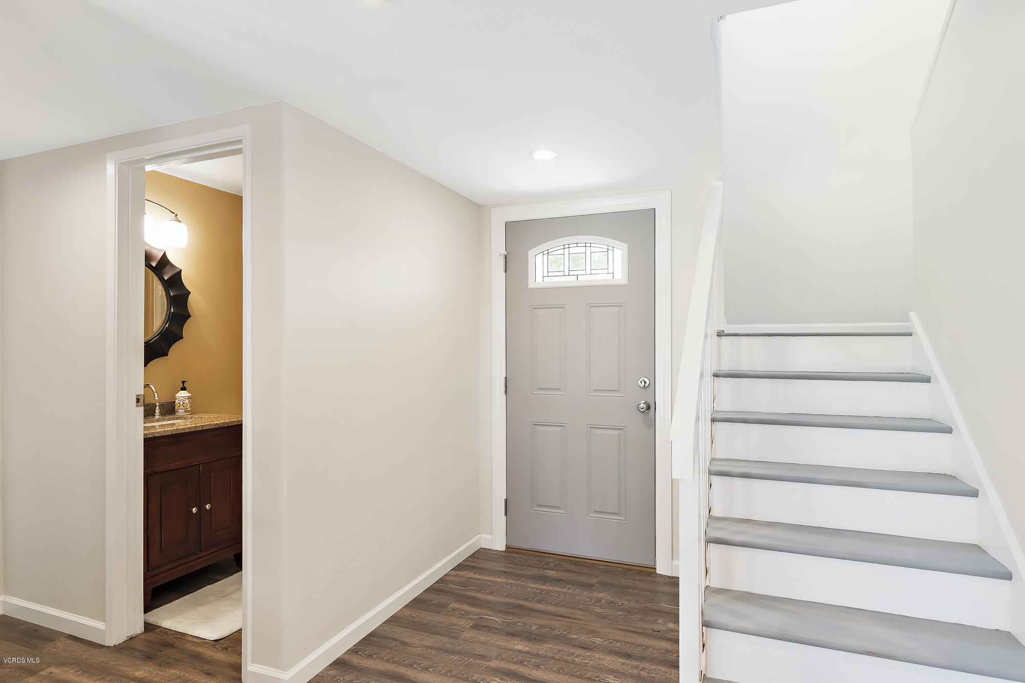 2551 Fitzgerald Road Simi Valley, CA 93065 - Photo 3 of 17 a view of an entryway with wooden floor and door