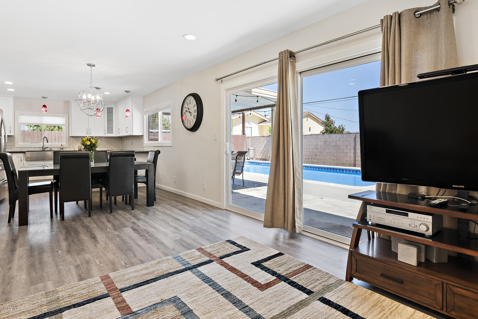 2551 Fitzgerald Road Simi Valley, CA 93065 - Photo 4 of 17 a view of a dining room with furniture and wooden floor